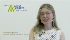 Rebecca Evans, wearing glasses and a white crochet top, stands against a plain backdrop with the "EASO Early Career Network" logo. Text reads: "Winner of the ECN Best Thesis Award.